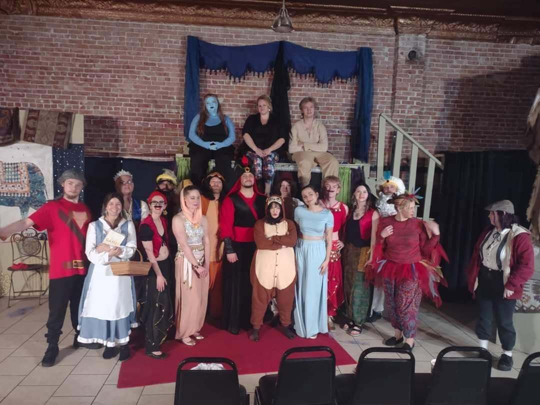 The full Twisted company in costume on the studio set
