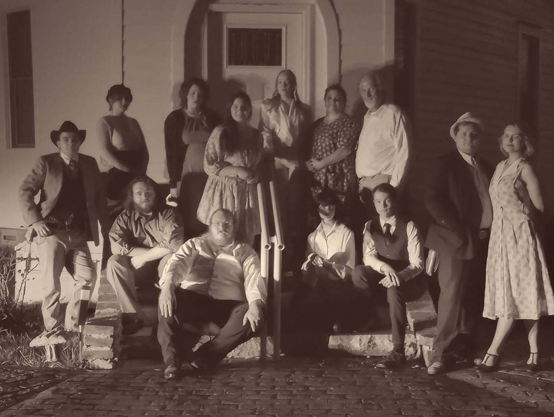 The Bonnie & Clyde company posed on church steps at night (sepia)