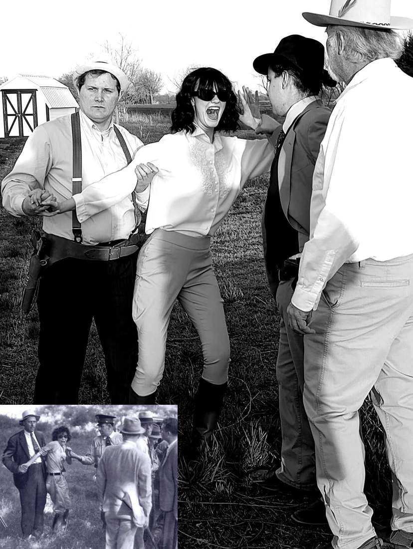 A cast member in sunglasses recreating Bonnie Parker's famous capture photo, held back by officers, with the original photo inset (black and white)