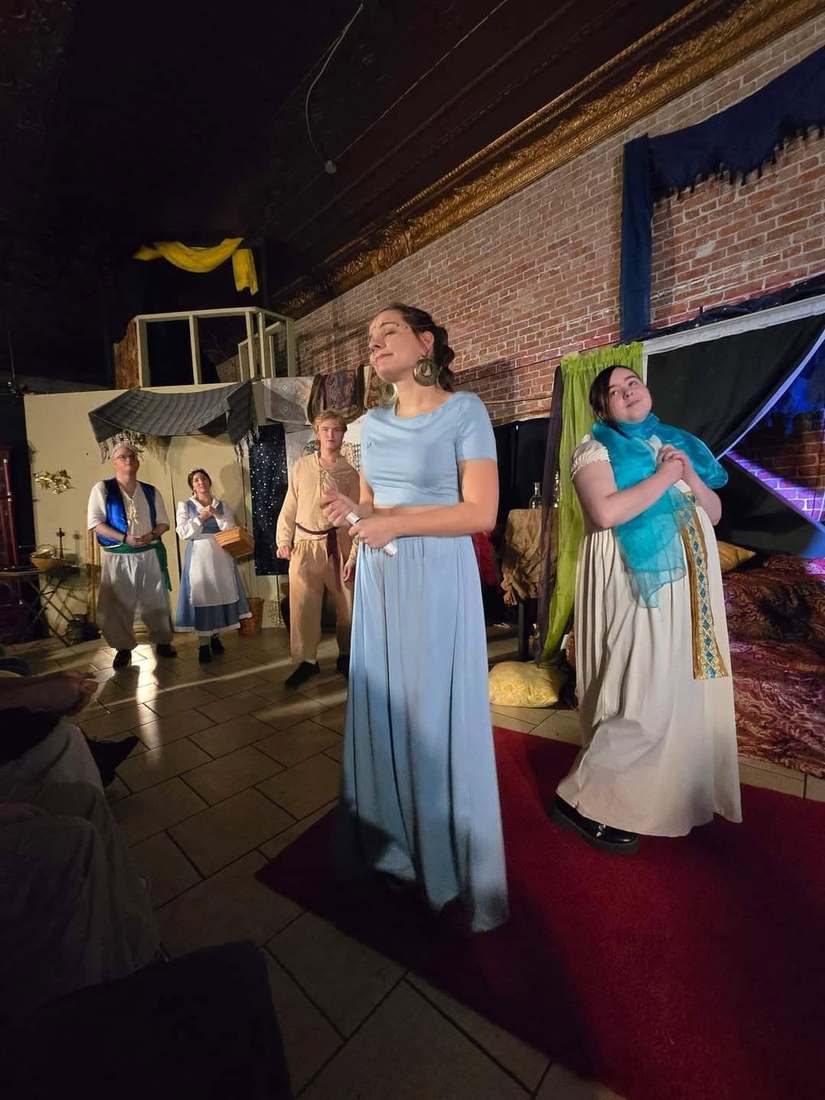 The princess sings center stage with the ensemble behind her in Twisted