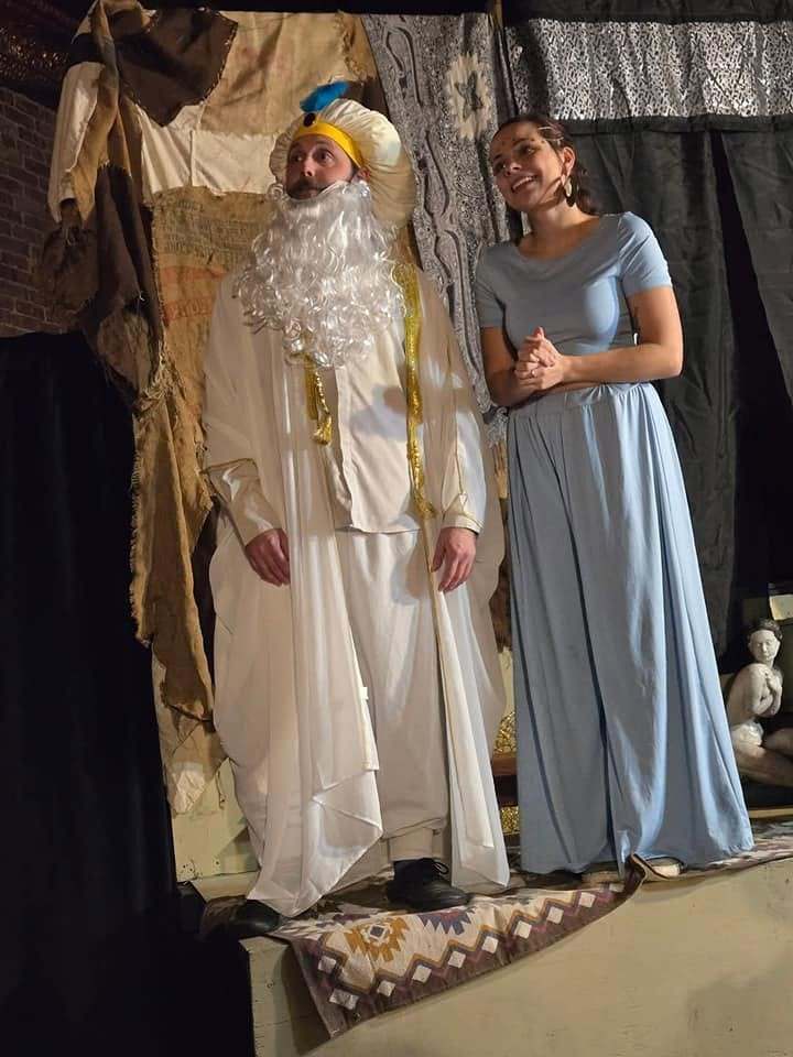 The Sultan, in white robes and a great white beard, stands with the princess in Twisted