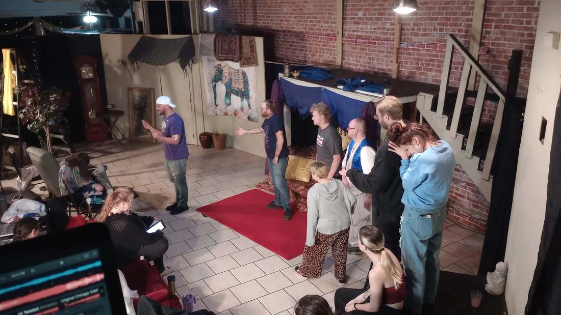 Cast members talk through a scene on the Twisted set during rehearsal