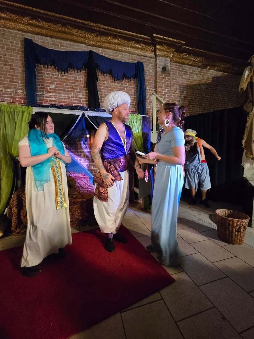 The prince, now in a white turban, shows the princess a letter in Twisted