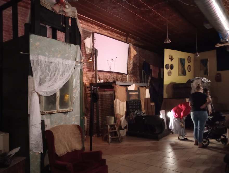 Inside the Bonnie & Clyde set: a lace-curtained shanty window and a red armchair