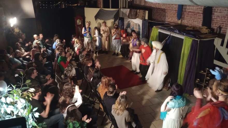 The Sultan in white robes takes his bow at the Twisted curtain call