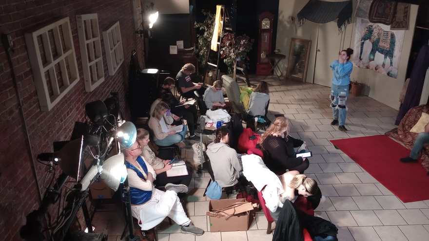 The Twisted cast in rehearsal at the studio, scripts in hand, one performer already in a blue vest costume