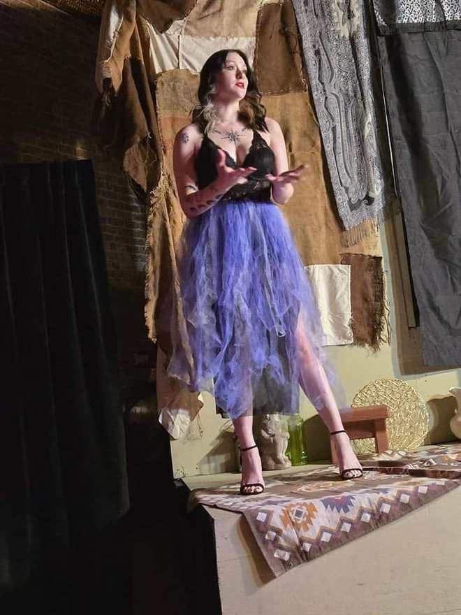 The storyteller sings from the platform in Twisted