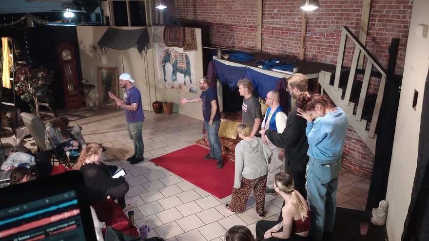 Cast members talk through a scene on the Twisted set during rehearsal